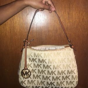 Brown Michael Kors handbag.